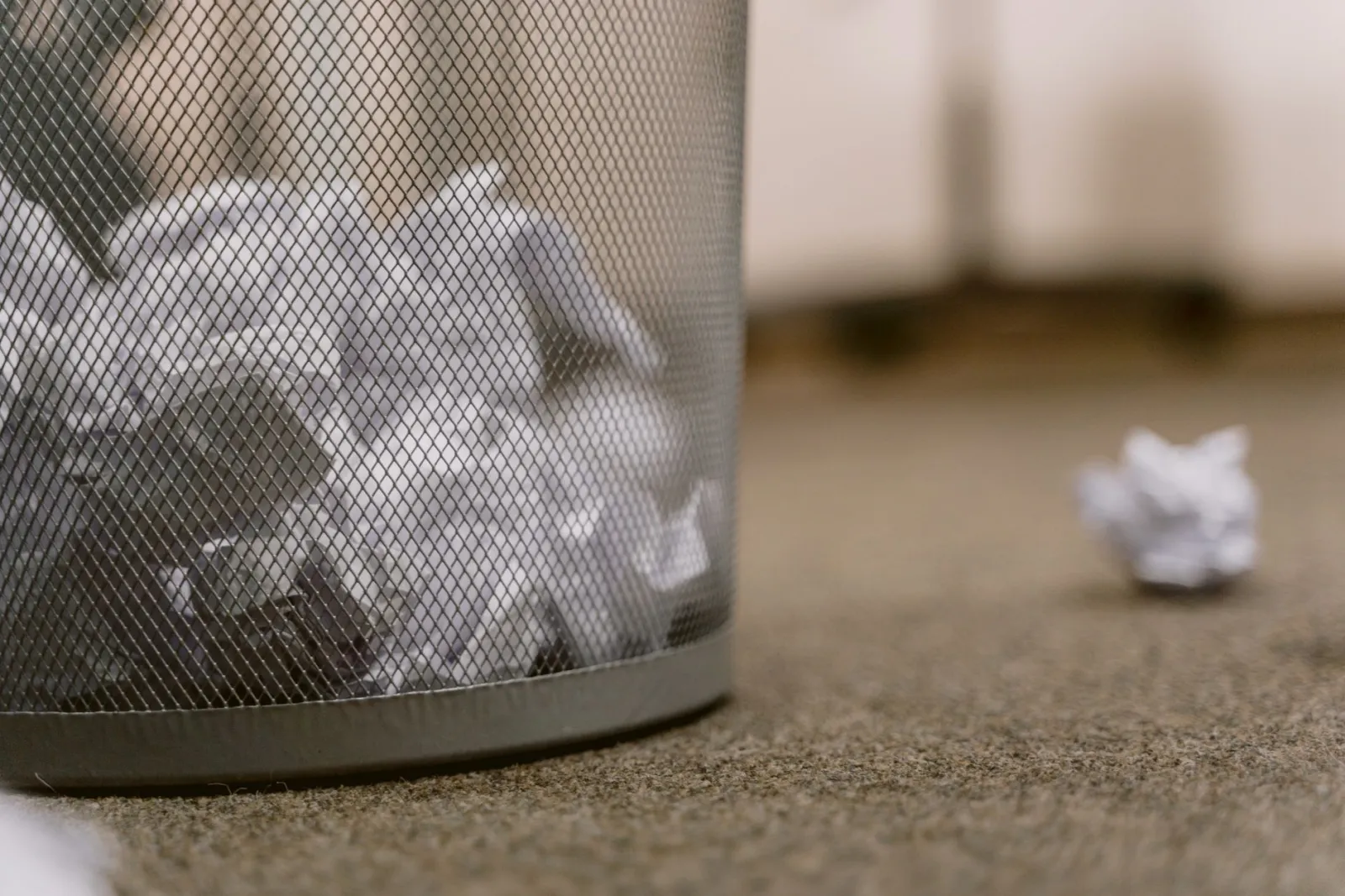 Wastebasket full of shredded and crumpled paper