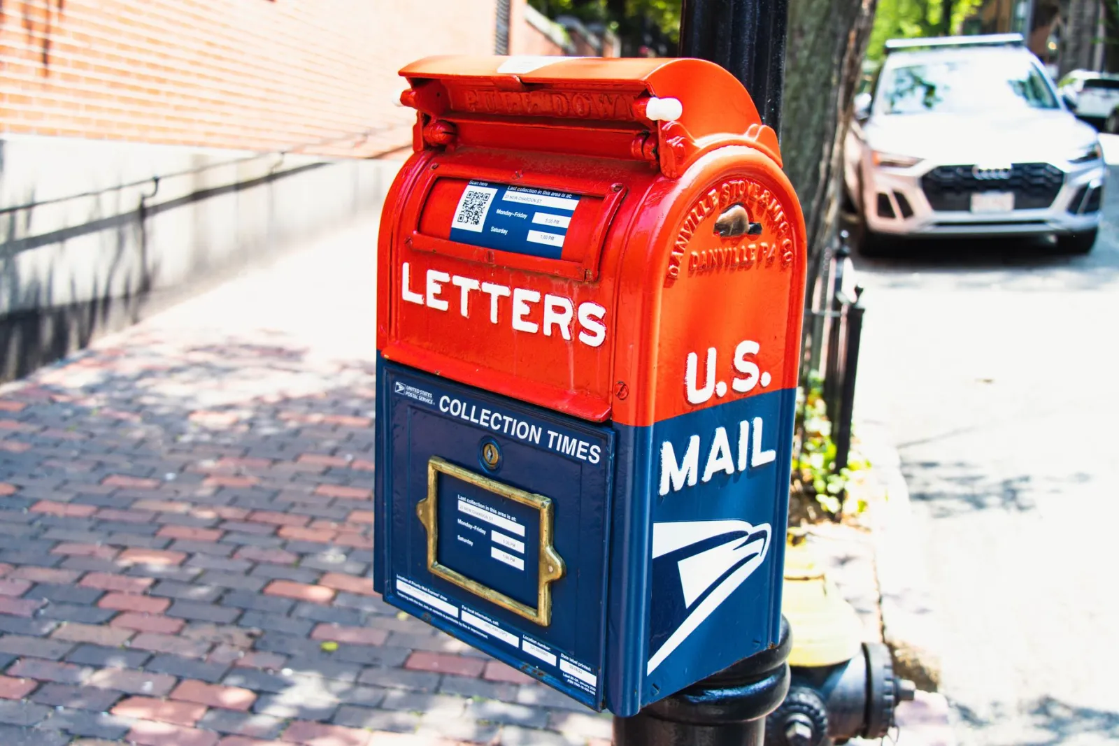 U.S. Mail collection box on a brick sidewalk